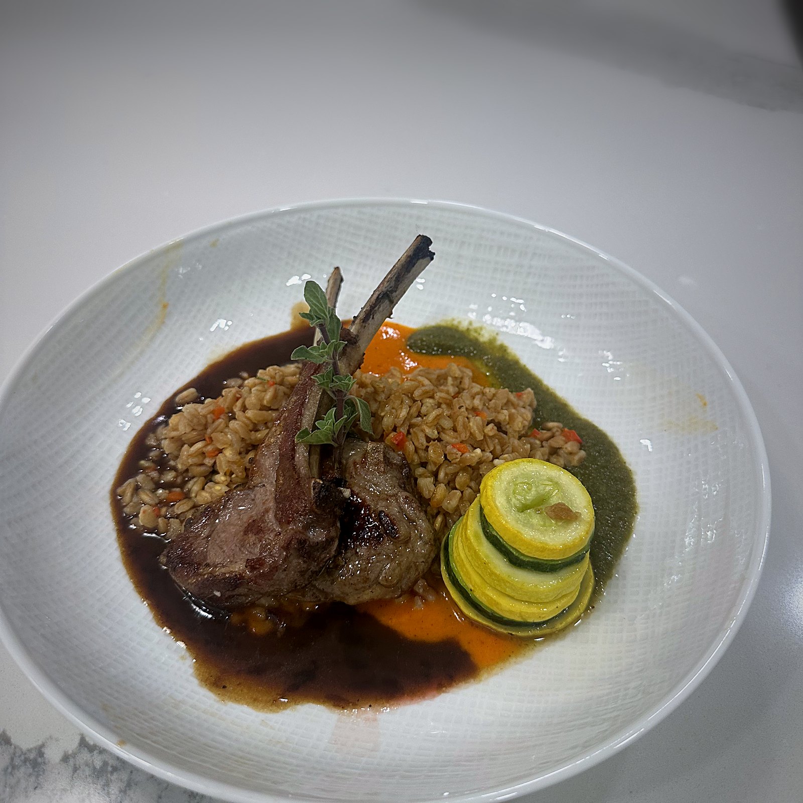 Herb-crusted lamb with a rich jus