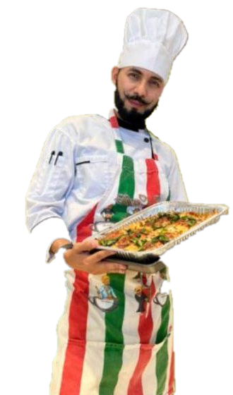 Chef Luigi holding a tray of freshly baked food, standing in an old Tuscan doorway